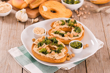 Friselle with turnip tops and hummus.