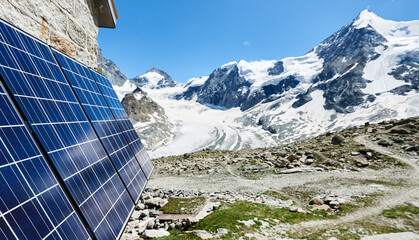 Close-up perspective snapshot of solar modules installed on the walls of alpine hut in Swiss Alps...
