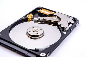 Internal parts of a hard disk isolated on a white background. Close up of Hard disk drive inside view.