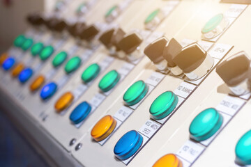 Key switch select mode in electrical control panel contains switch buttons for operating industrial machine and factory equipment in industry