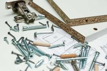 spare parts for home furniture assembly top view. furniture fittings background.