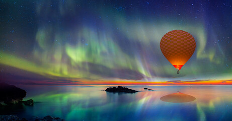 Hot air balloon flying with spectacular Northern lights - Northern lights (Aurora borealis) in the...