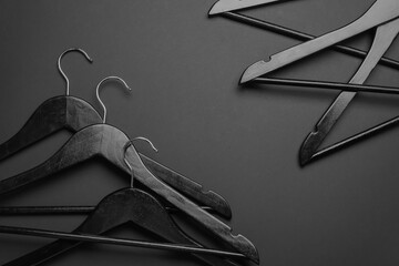 Clothes hangers on dark background