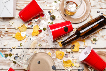 Mess after party celebration on wooden background