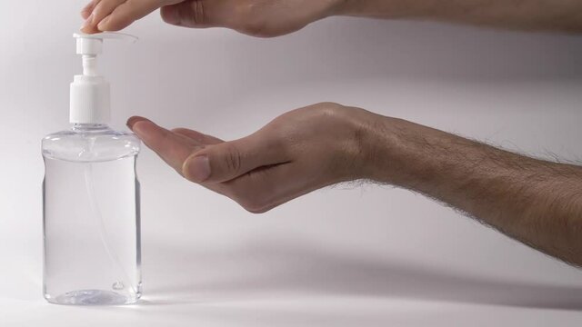 Personal hygiene using alcoholic-based hand sanitizer against white background