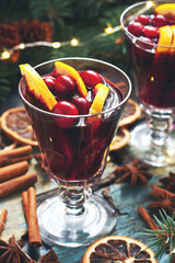 Mulled wine with citrus and  cranberry  in  glass