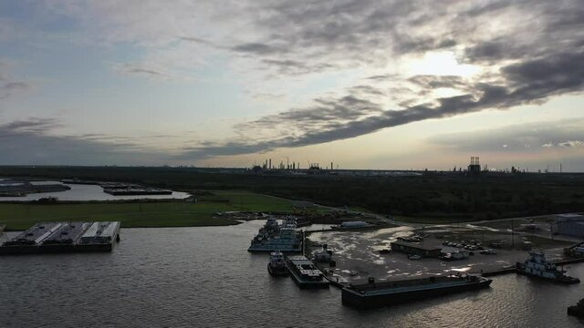 Push boats docked near Bridge City Texas as the sun sets
