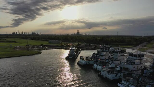 Point of view flight around docked push boats near Bridge City, Texas