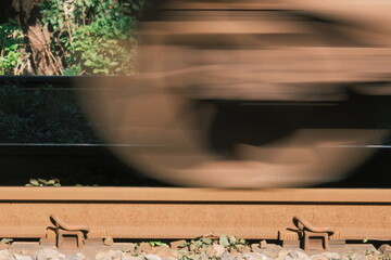 wheels of a train passing by over an old railway