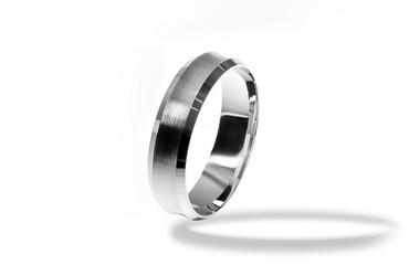 Golden wedding ring on a white background.