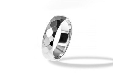 Golden wedding ring on a white background.