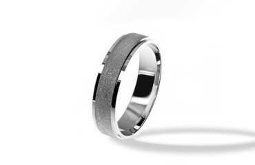 Golden wedding ring on a white background.