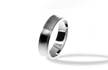 Golden wedding ring on a white background.