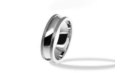 Golden wedding ring on a white background.