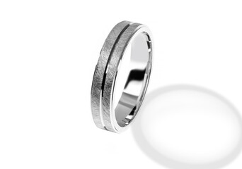 Golden wedding ring on a white background.