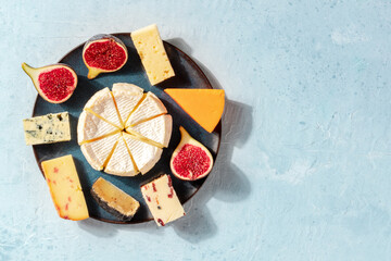 Cheese selection with copy space. A banner with an assortment of cheeses with a place for text, shot from the top