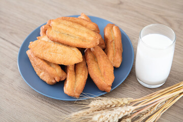 Prepared deep-fried dough sticks and warm milk