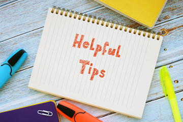 Business concept meaning Helpful Tips with phrase on the page.