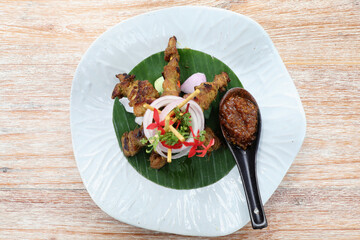Chicken Satay on dark brown table street food appetizer