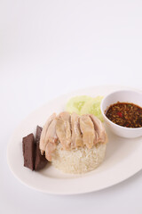 Thai food gourmet steamed chicken with rice , khao mun kai in wood background