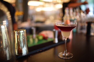 cocktails in glasses on bar counter in pup or restaurant