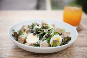 caesar salad appetizer on wooden background