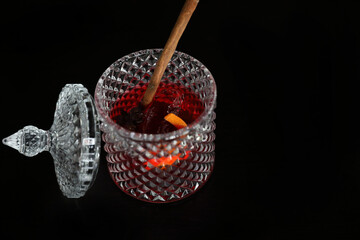 Pink Cocktail glass with ice at a bar counter