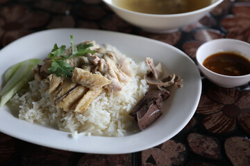 Thai food gourmet steamed chicken with rice in wood background