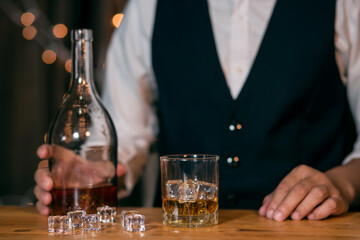 Barman pouring whiskey whiskey glass beautiful night