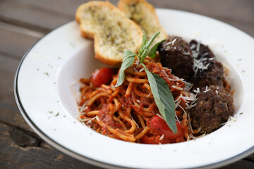 Spaghetti Meatballs on wood background