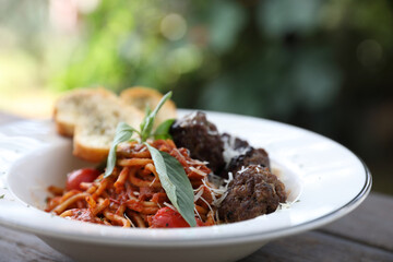 Spaghetti Meatballs on wood background