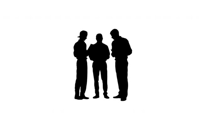 Silhouette Three similar dressed guys reading some documents while one of them is springing his legs.