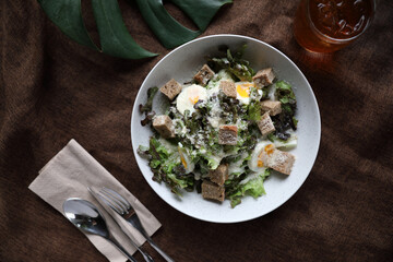 caesar salad appetizer on wooden background