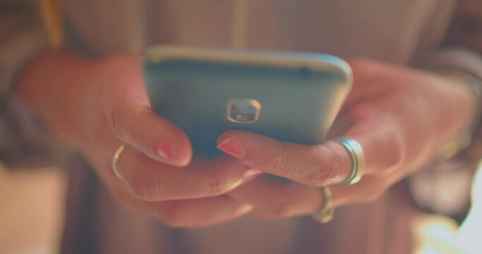 Hands of Young African American Woman on Smartphone Texting Messages,  Close Up Detail Full Frame