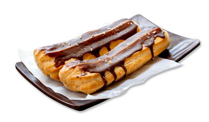 éclair, an oblong pastry made with choux dough filled with a cream and topped with chocolate icing. filled with a vanilla flavoured custard isolated on white background