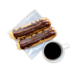 éclair, an oblong pastry made with choux dough filled with a cream and topped with chocolate icing. filled with a vanilla flavoured custard isolated on white background