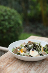 caesar salad appetizer on wooden background