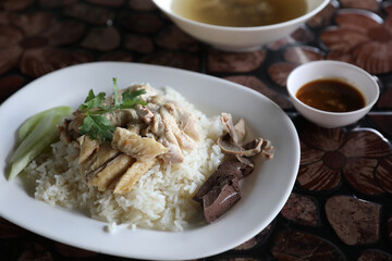 Thai food gourmet steamed chicken with rice in wood background