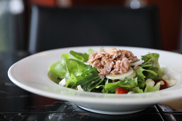 Tuna salad appetizer on wood background