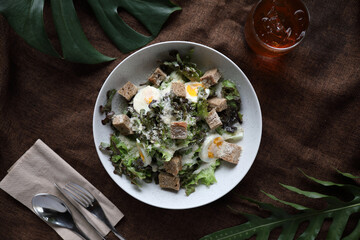 caesar salad appetizer on wooden background