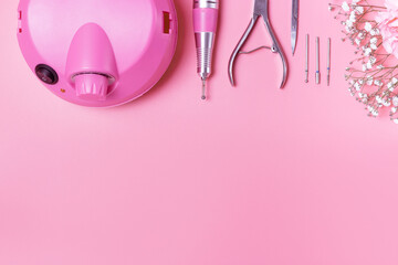 Manicure accessories on pink background, copy of the space