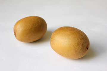 Whole kiwi fruit isolated on white background. Clipping Path. Full depth of field.