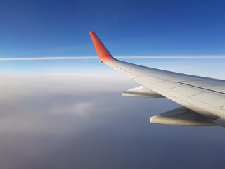 Wing aircraft in the blue sky