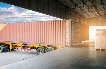 Cargo freight truck, Shipment boxes, Logistics and transportation. Trailer truck docking to load cargo at the warehousing.