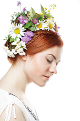 woman with large hairstyle and flowers in her hair.