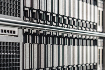 cluster of data storage SSD hard drives inside server rack