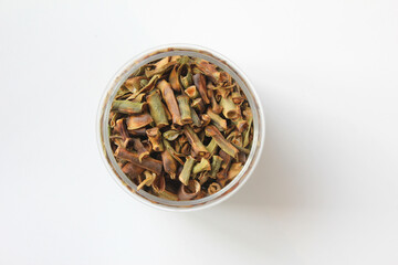 dried bean podsin glass bottle isolated on white background