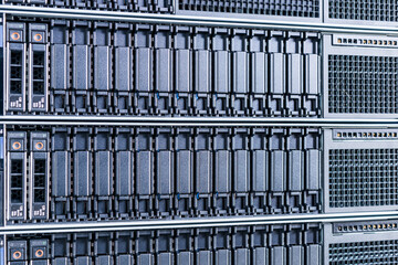 cluster of data storage SSD hard drives inside server rack