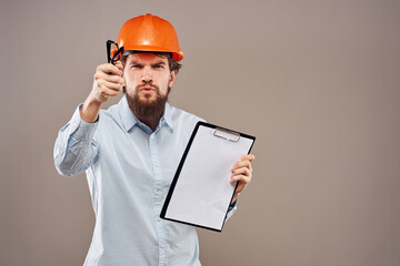 Cheerful male engineer orange hard hat professional construction work