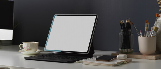 Home office desk with tablet, stationery, smartphone and accessories, clipping path